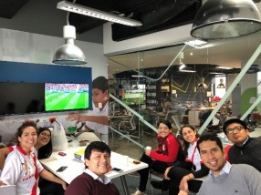 IdentityX Ambassador Luisa Torres and her internship colleagues watching the World Cup in Lima, Peru.